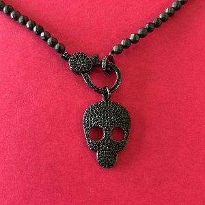 Black designer crystal skull necklace.